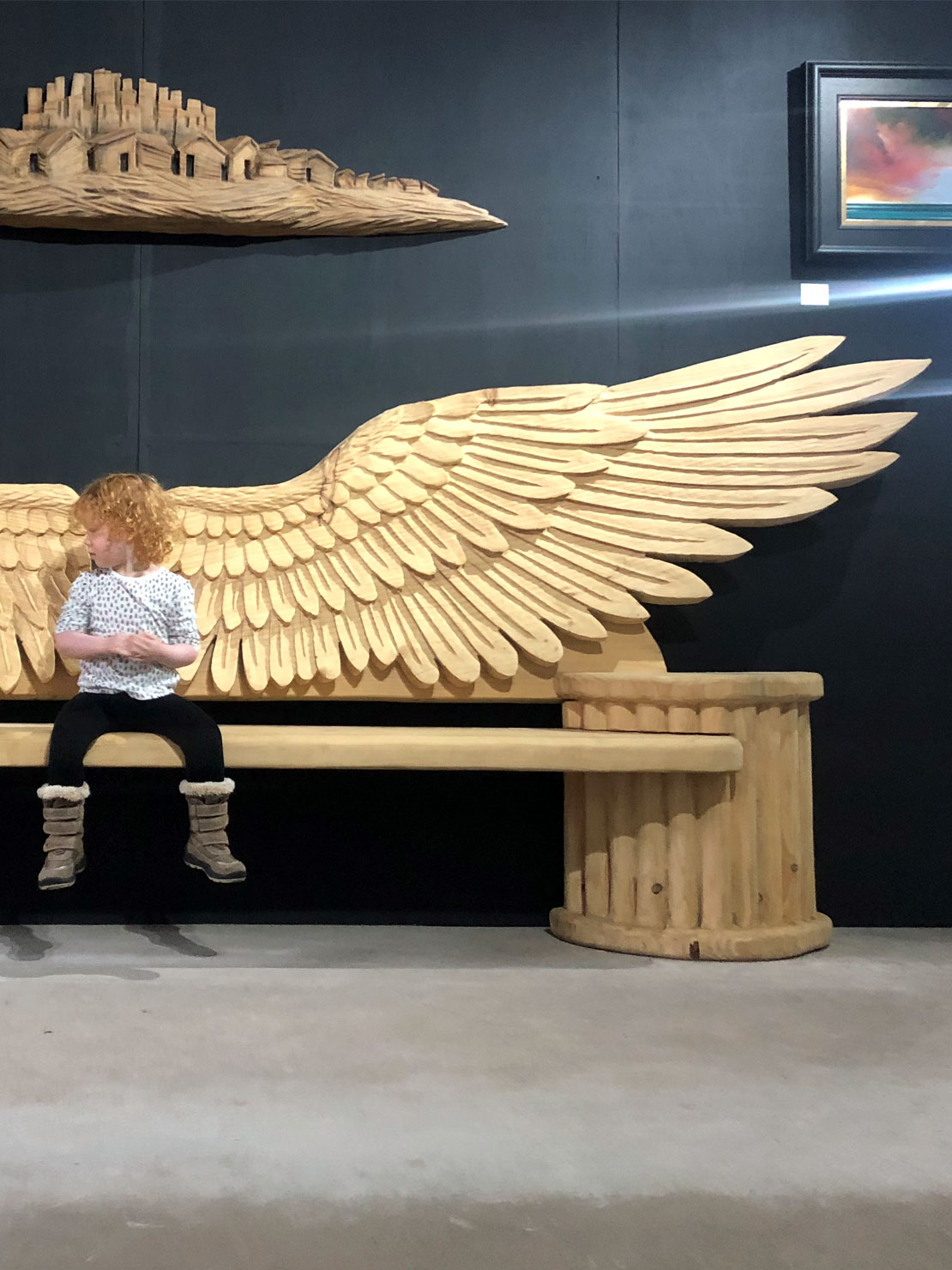 Angel wings carved wooden bench