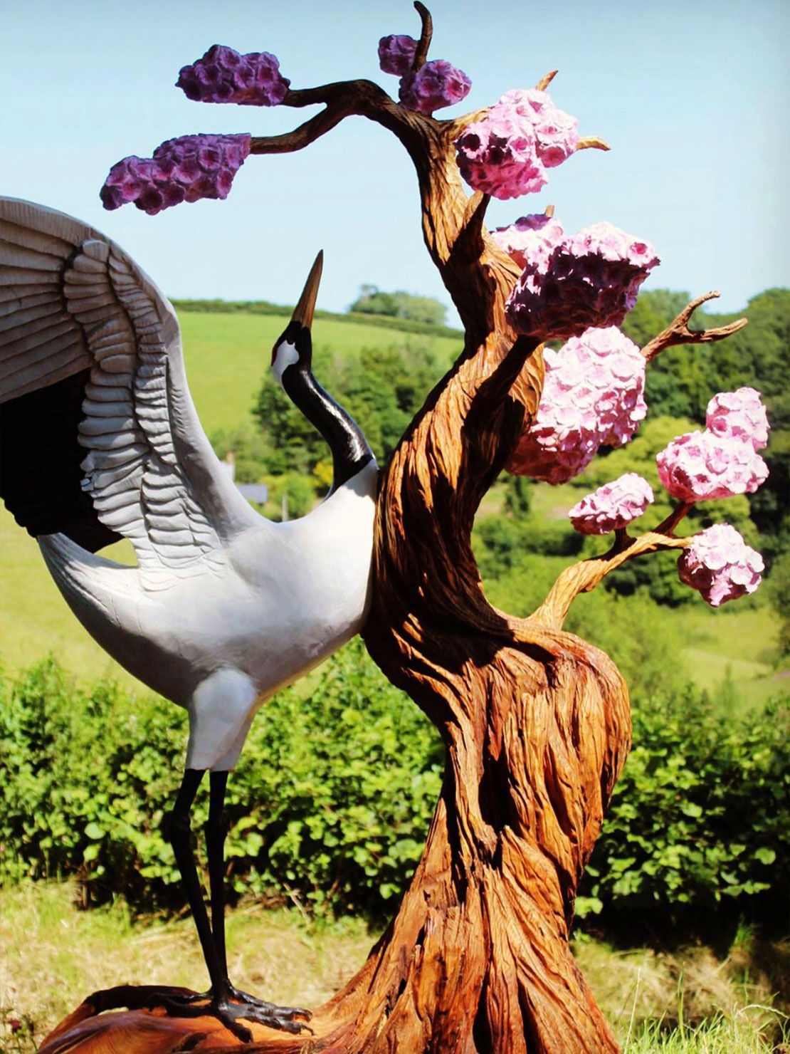 Painted wooden sculpture of a crane