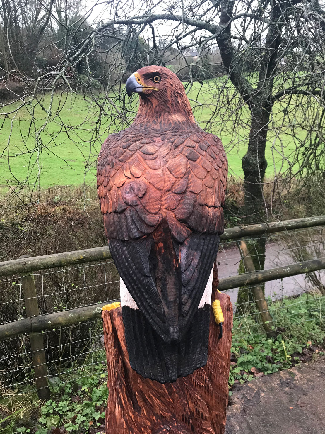 Wooden sculpture of a golden eagle