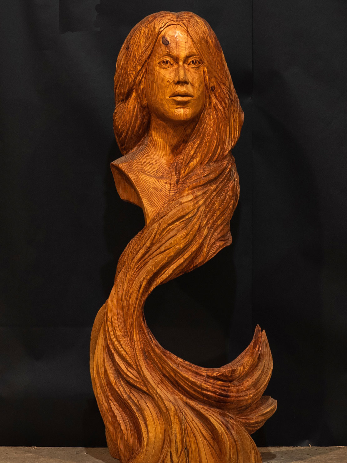 Girl's head , wooden carving by Matthew Crabb