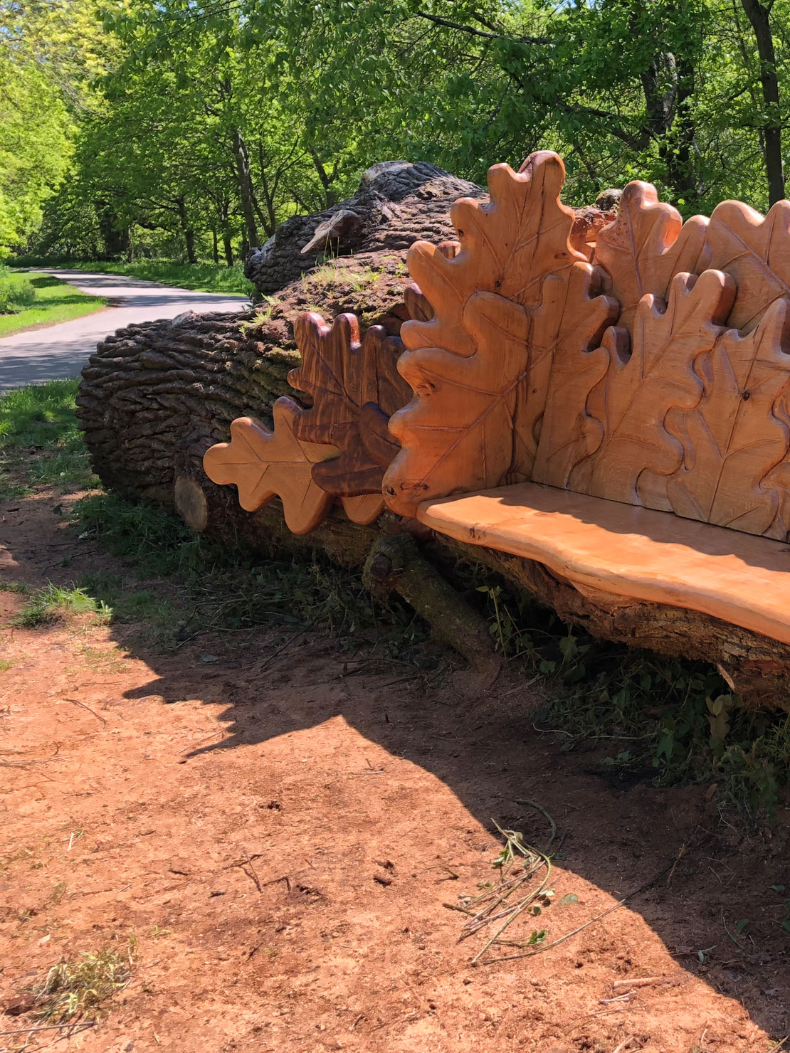 Carved oak bench with oak leaf design