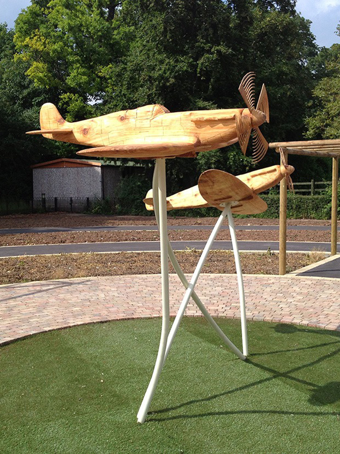 Carved wooden spitfires by Matthew Crabb
