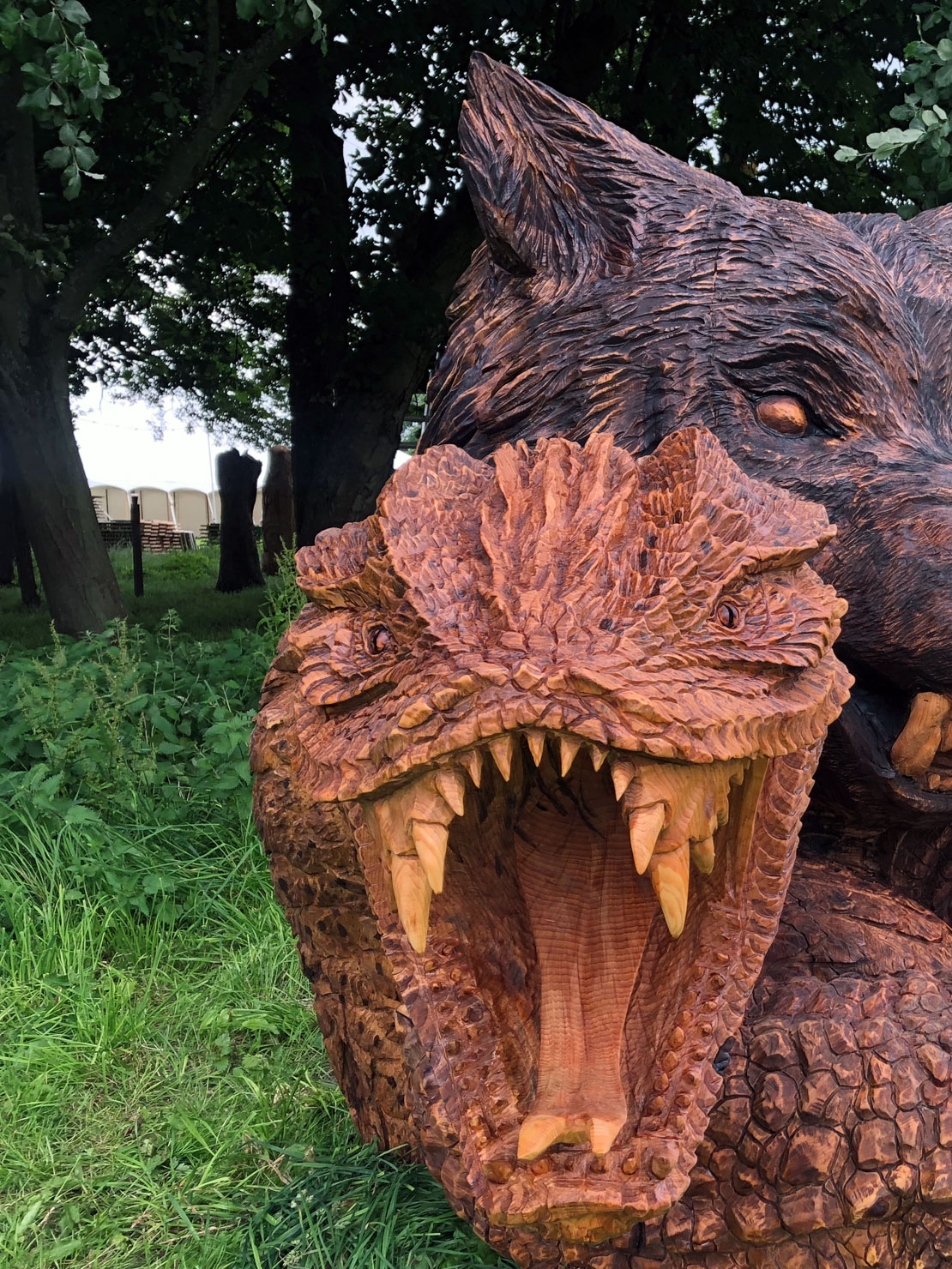 Bear snake head carving