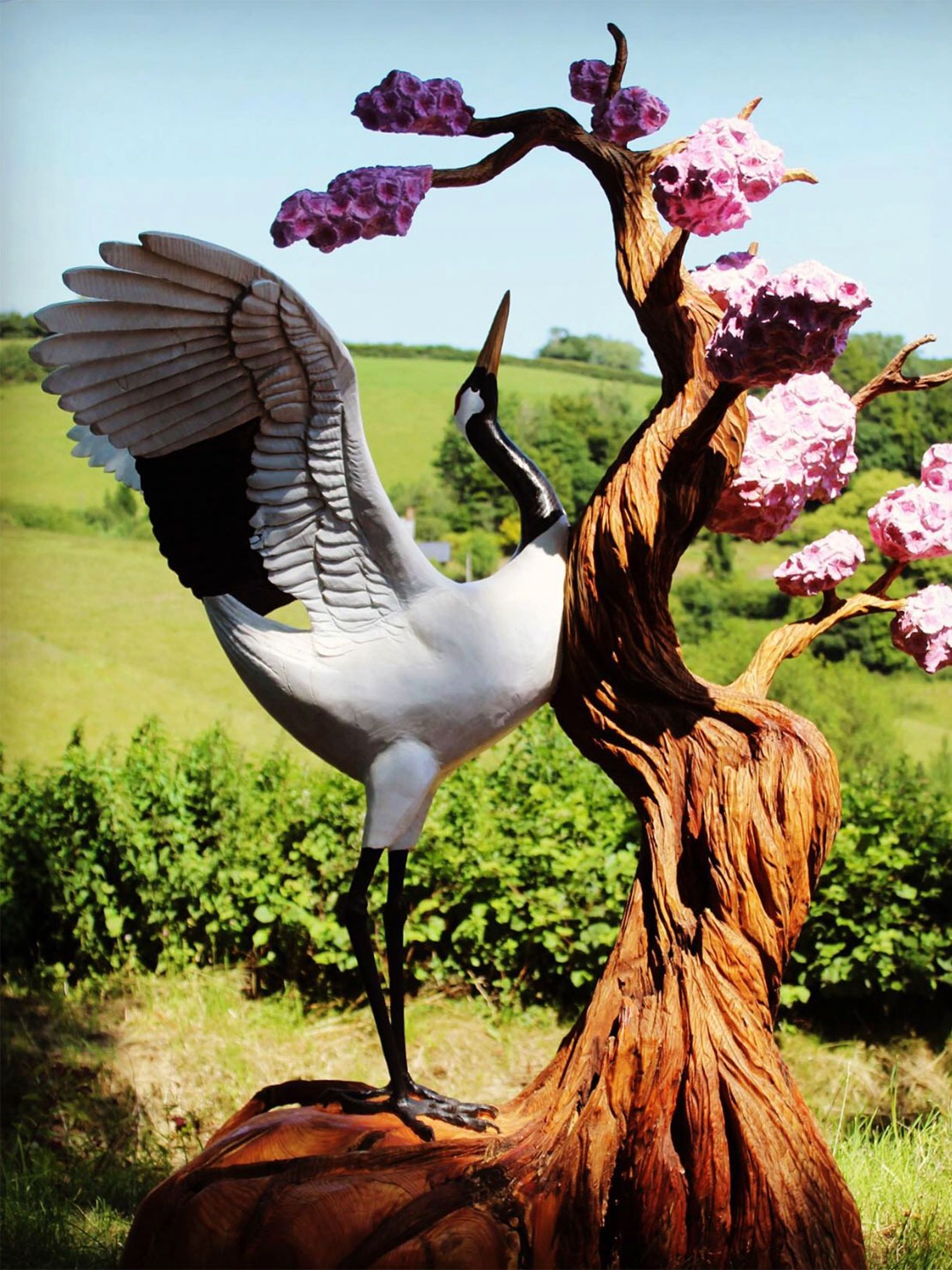 Painted wooden sculpture of a crane