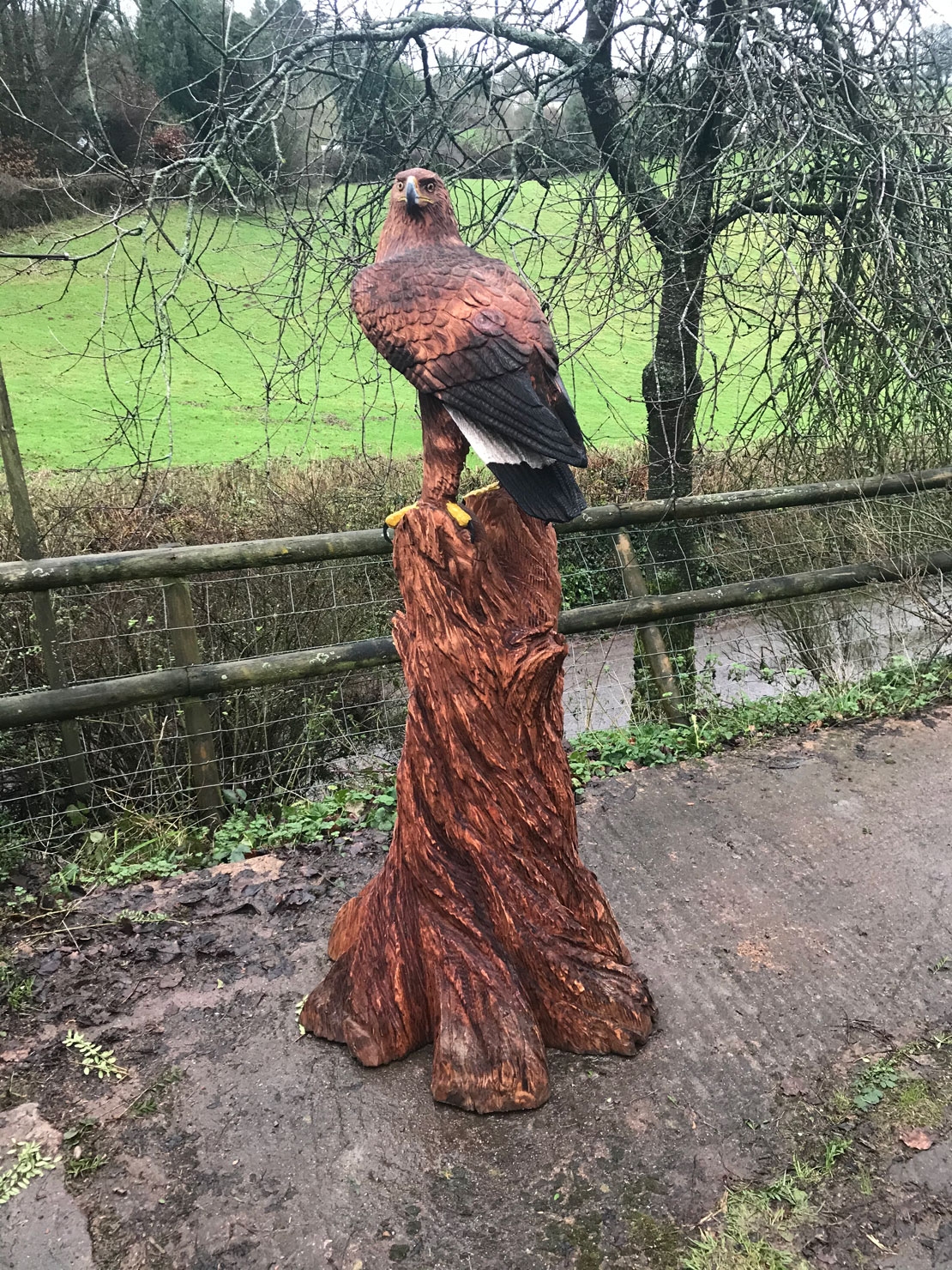 Wooden sculpture of a golden eagle