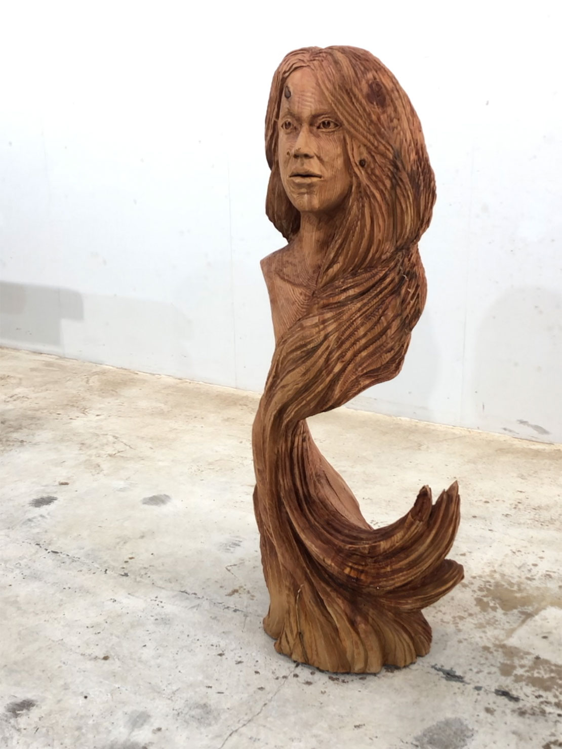 Girl's head , wooden carving by Matthew Crabb