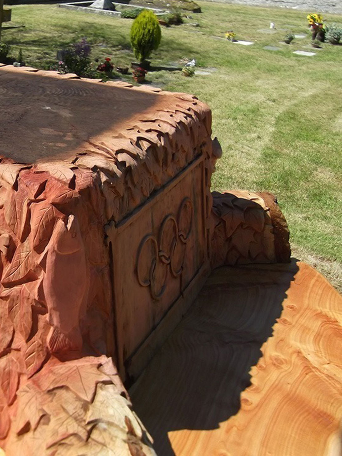 Carved wooden jubilee bench at Butleigh Church by Matthew Crabb