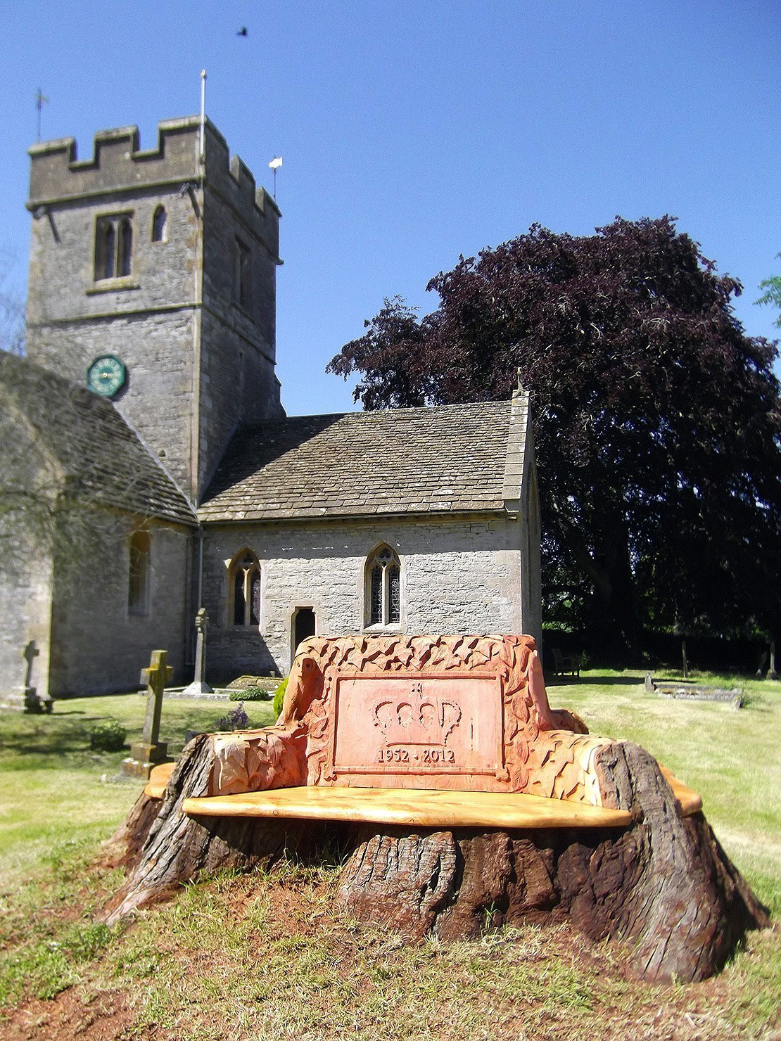 Carved wooden jubilee bench at Butleigh Church by Matthew Crabb Carved wooden jubilee bench at Butleigh Church by Matthew Crabb