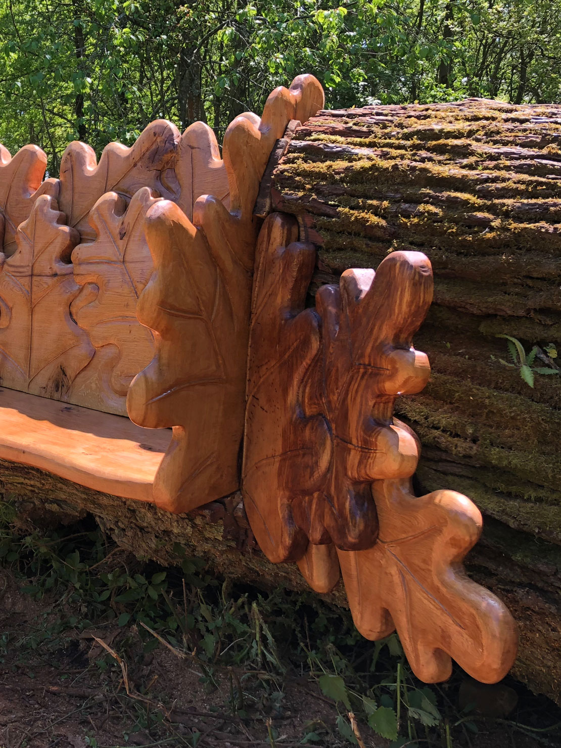 Carved oak bench with oak leaf design