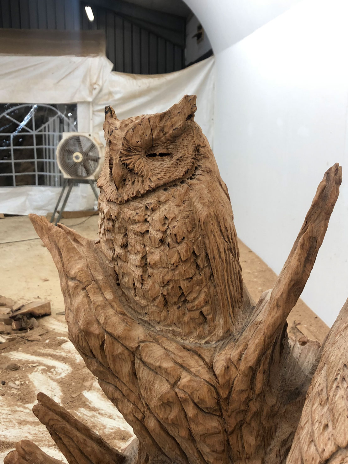 Carved wooden owl bench by Matthew Crabb
