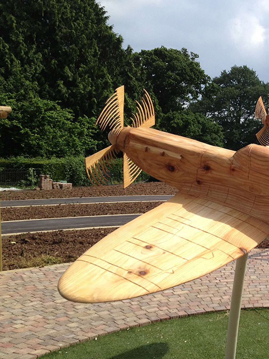 Carved wooden spitfires by Matthew Crabb