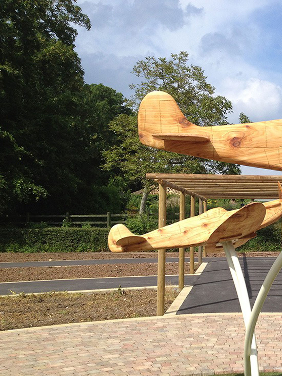 Carved wooden spitfires by Matthew Crabb