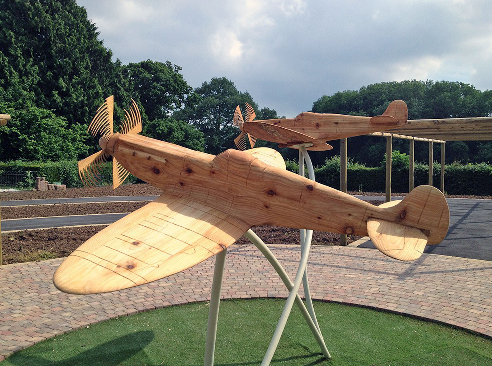 Carved wooden spitfires by Matthew Crabb