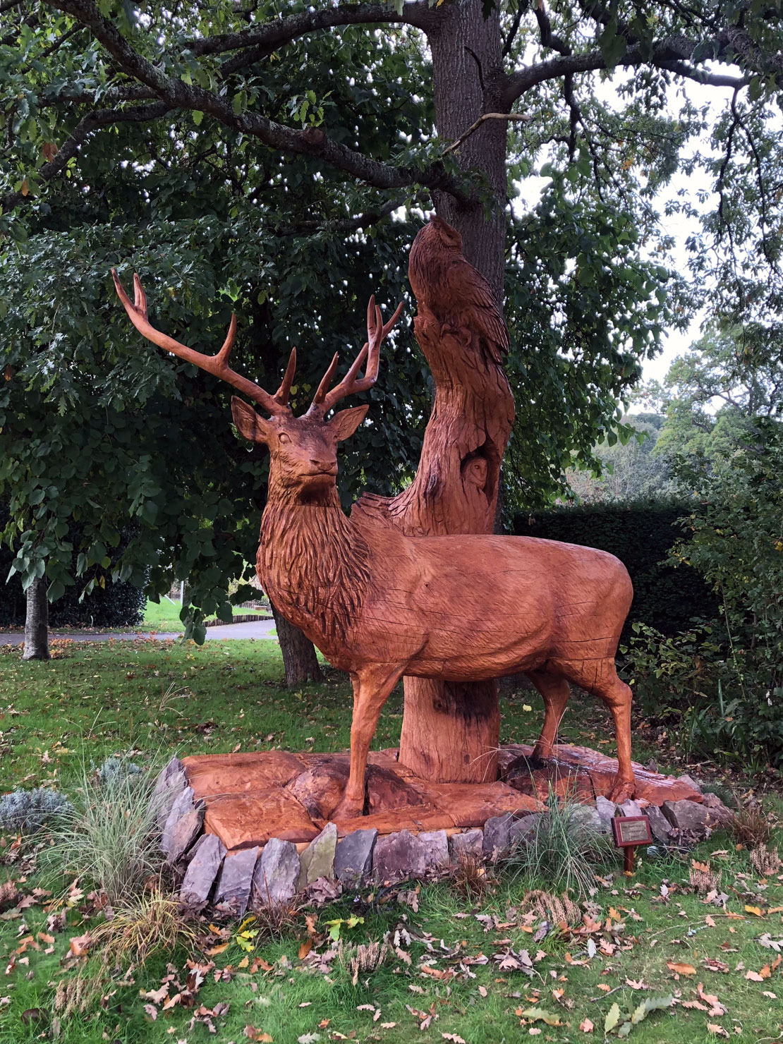 Wooden sculpture of a stag with an owl Wooden sculpture of a stag with an owl